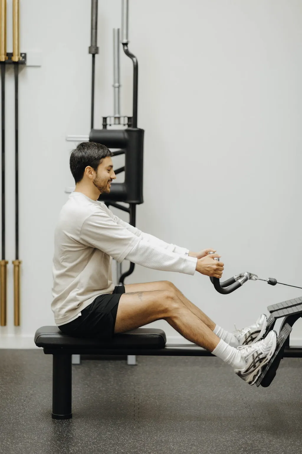 Coach Santi rowing on the cable machine at Focus Athletics in Costa Mesa, clean technique is what South Orange County clients learn from rep one
